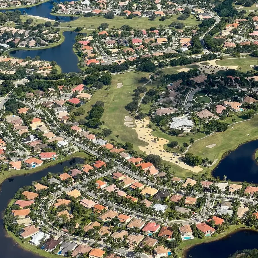 Aerial view of a Valrico / FishHawk, FL golf community with palms and lakes